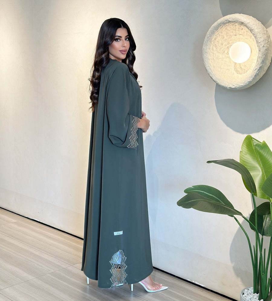 ‎ ‎The green abaya